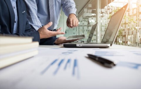 Business adviser analyzing financial figures denoting the progre